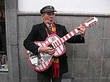 Ecuador Quito 05-01 Old Quito Colourful Guitarist As we walked down the street a colourful guitarist was singing a beautiful Spanish song.